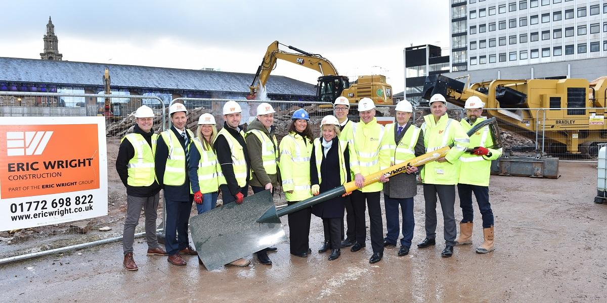 People holding large spade to mark work starting on Animate project People holding large spade to mark work starting on Animate project